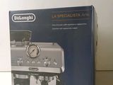 packaging of a coffee machine sitting on top of a white counter