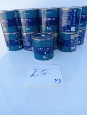 a group of cans of blue paint sitting on top of a white table