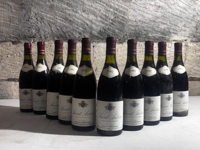 six bottles of wine are lined up in a row on a table