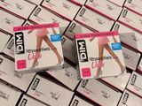 boxes of condoms are stacked on top of each other on a table