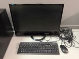 a computer monitor, keyboard, mouse and mouse on a desk