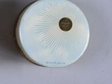 a picture of a white container with a sunburst on it