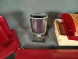 two red chairs and a cup of coffee on the table