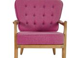 a pink chair with a wooden frame and a pink cushion