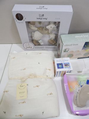 a white box with a stuffed animal and other items on it