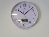 a clock that is on the wall above a door