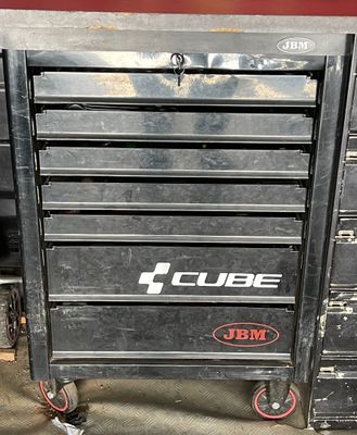 an image of a black tool box with red wheels