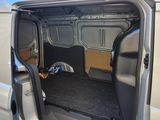 a white van with its door open and the interior of the van is empty