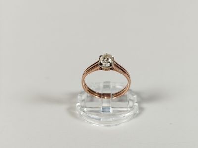 a close up of a ring with a diamond on top of it