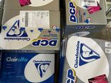 boxes of cleaning supplies are stacked on a carton in a store