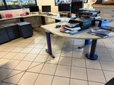 an image of a desk with a lot of books on it