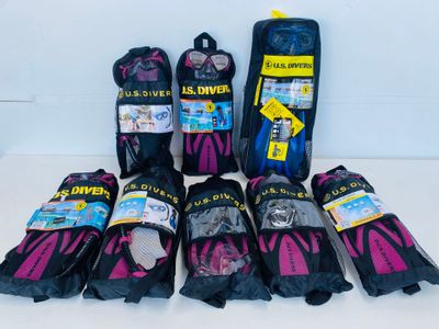 many bags of items that are sitting on a table