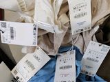 a pile of clothes with price tags on them