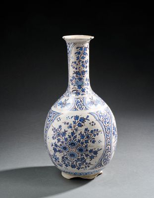 a blue and white vase sitting on a table