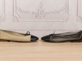 two pairs of black and beige shoes sitting on top of a wooden floor