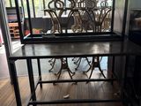 a table that has a metal frame on top of it