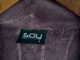 a close up of a purple coat hanging on a wooden hanger