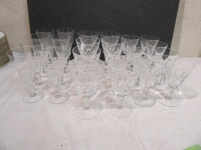 a lot of wine glasses sitting on a table