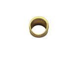 a close up of a gold ring on a white surface