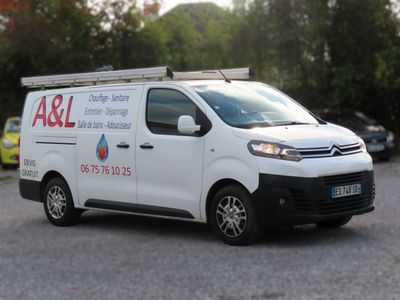 a white van that is parked in a parking lot