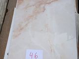 a lot of marble on the ground in a box