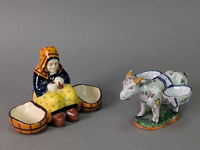 deux figurines représentant une femme et une vache