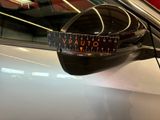 an image of a car mirror with a sticker on it