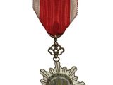 l'image d'une médaille surmontée d'une étoile