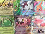 several pokemon cards are displayed on a table in a room