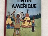 un vieux livre pour enfants sur lequel figure l'image d'un Indien et d'un enfant