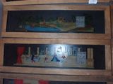 two wooden shelves with pictures on them in a room