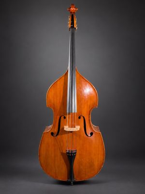 an old cello on a black background
