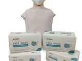 three boxes of face masks and a mannequin head on a white background