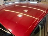 a red car that is parked in a garage