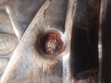 a close up of a metal object with a rusted surface
