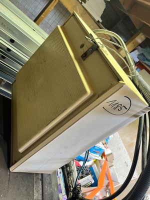 a box that is sitting on the ground next to a hose