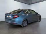 the rear end of a blue car parked in a garage