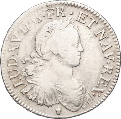 une pièce d'argent portant une tête de femme et une couronne