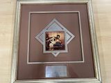 a picture of a framed picture of a man and a woman