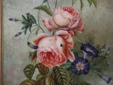 a painting of pink roses and blue pansies in a gold frame