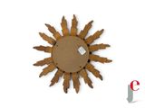 a wooden sunburst on a white background