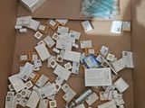 a cardboard box filled with many different types of electronic devices