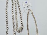 two pieces of silver necklaces and a chain with a clasp