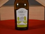 a bottle of wine that is sitting on a table