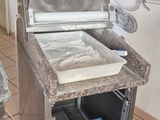 a kitchen with a stove and a refrigerator in it