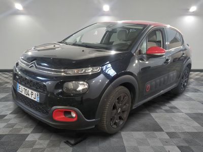 the black citrole is parked in the garage on a checkered floor