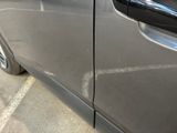 a close up of a car door handle with a sticker on it