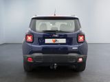 the rear end of a blue jeep compass parked in a room