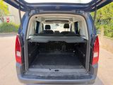 the back end of a van with the trunk open