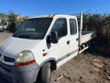 a white truck that is parked in the dirt